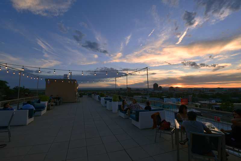 A rooftop bar at sunset