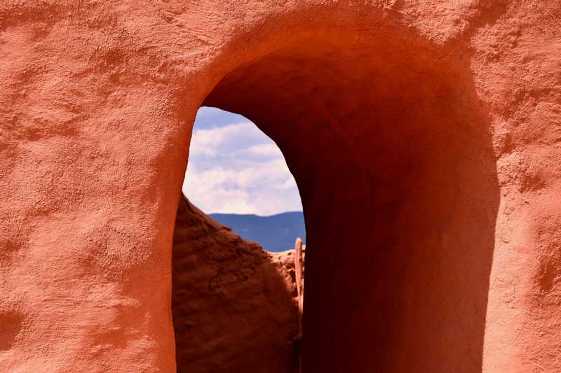 Adobe door looking onto mountains