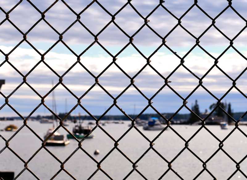 Boats soft focused through fence