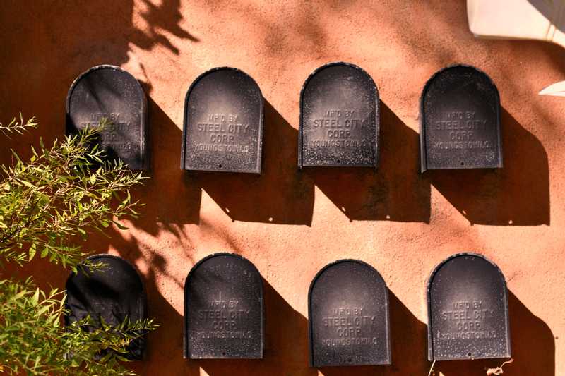 Eight mailboxes in wall on Canyon Road